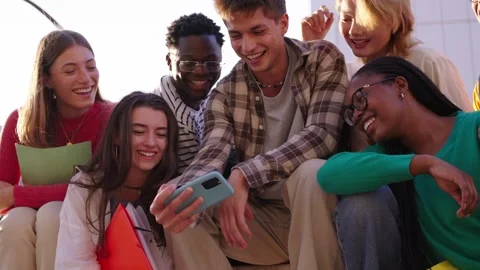 A large multiracial group of teenagers taking a selfie looking front camera Stock Footage 271157083