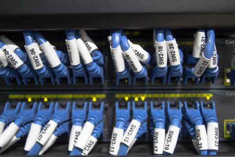 Large network hub and connected internet cables Stock Photos