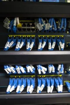 Large network hub and connected internet cables Stock Photos