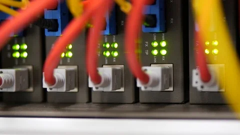 Large network switch and connected red internet cables Stock Footage 88408904