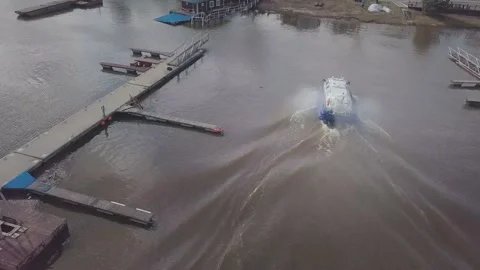 Large new hovercraft sails along wide blue river aerial view Stock Footage 155286520