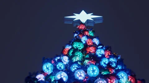 Large New Year tree glowing with colorful lights on the street Stock Footage 119491851