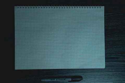 Large notebook and black marker in candlelight Stock Photos