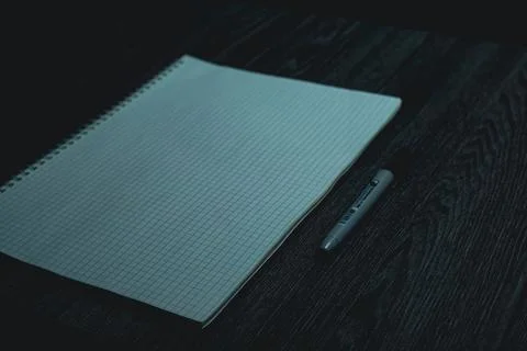 Large notebook and black marker in candlelight Stock Photos