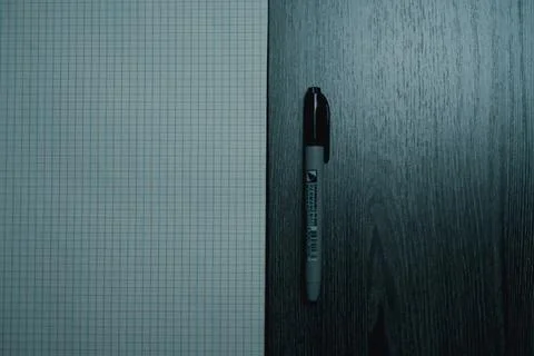Large notebook and black marker in candlelight Foto stock