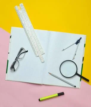 A large notebook for notes and drafting with stationery objects for a student 库存照片