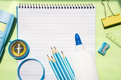 Large Notebook with Stationery and Tools on Green Background Stock Photos