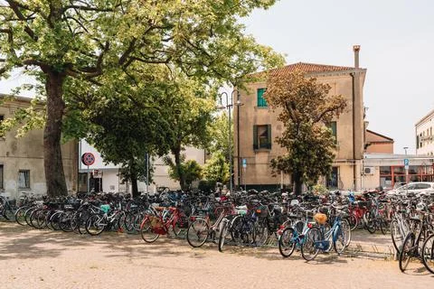Large number of bikes parked on a town square on Lido Island, Venice, Italy. Stock Photos