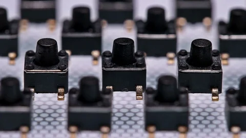 A large number of buttons ,for soldering on the control Board Stock Footage 79591942