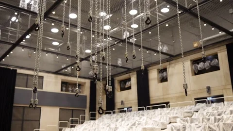 Large Number of Chained Hooks are Raised by Motorized Hoists Stock Footage 262111786