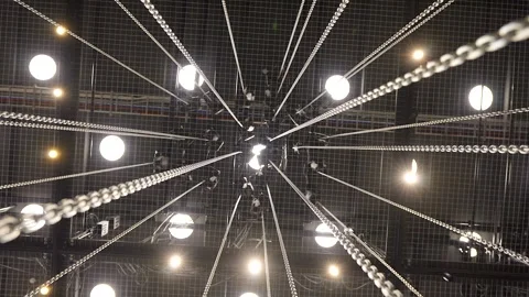Large Number of Chains Hanging from Motorized Hoists Stock Footage 262111679