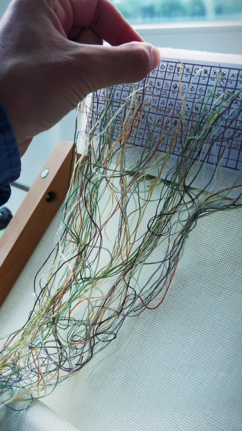 Large number of different threads. Floss threads for embroidery. Vertical video Stock Footage 330138391