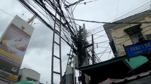 Large number of electrical wires above the street in the city. Stock Footage 250414070