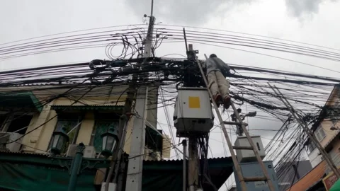 Large number of electrical wires above the street in the city. Stock Footage 250414098