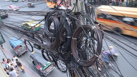 Large number of electrical wires on electric post above street Stock Footage 75665638