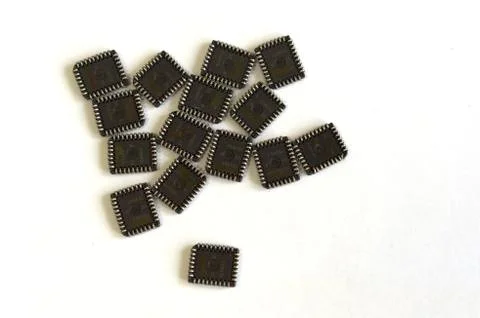 A large number of microchips, microcircuits on a white table Stock Photos