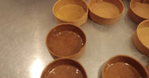 A large number of mini-tarts are laid out in even rows Stock Footage 253408549