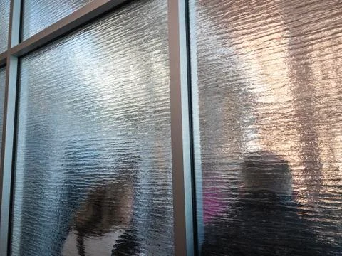 Large number of people queuing inside a building Stock Photos