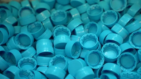 A large number of plastic bottle caps in a pure spring water bottling plant Video stock 149670411