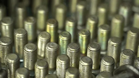 Large number of threaded bolts, close-up, selective focus, camera collision.  Video stock 148099763