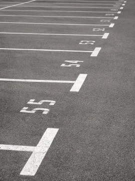 Large numbered parking space on top. Lines on gray asphalt. Stock Photos
