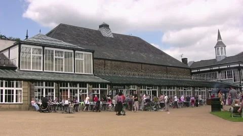 Large numbers of people visiting Buxton Pavilion and Pavilion Gardens Derbyshire Stock Footage 44792117