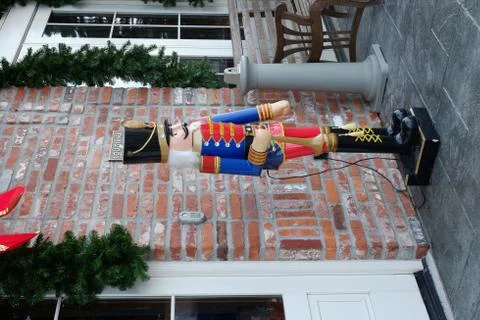 Large nutcracker in front of brick building 스톡 사진