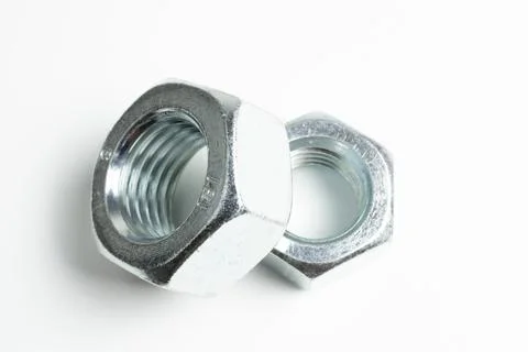 Large nuts made of silver metal close up Stock Photos