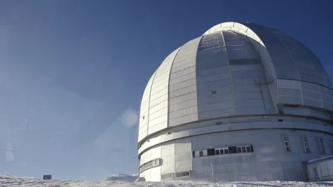 Large observatory dome in a snowy mountain setting Stock Footage 310230652
