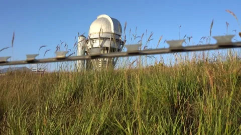 A large observatory is protected by a barbed fence Video stock 205214236