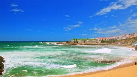 Large ocean waves are rolling on sandy beach during tide.   Beautiful azure o Stock Footage 204867207