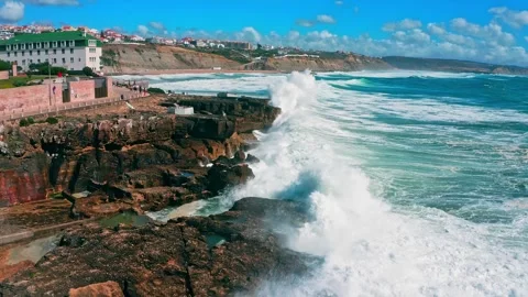 Large ocean waves crash about the  pier - slow motion. Big waves is  crashi.. Stock Footage 265579229