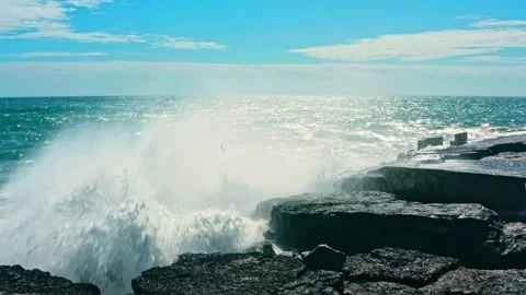 Large ocean waves crash about the  pier - slow motion. Big waves is  crashi.. Stock Footage 265579252