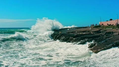 Large ocean waves crash about the  pier - slow motion. Big waves is  crashi.. Stock Footage 302865790