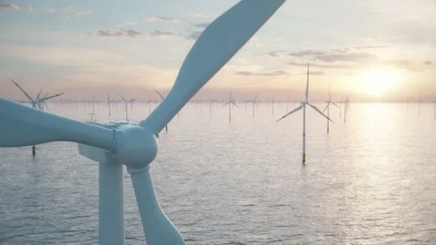 Large offshore wind farm or wind park in the sea against low sun Stock Footage 148320527