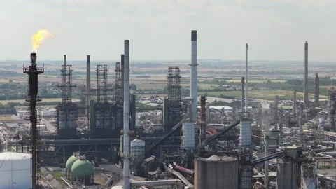 Large Oil Refinery Complex With Flare Stack Burning Bright During the Day Stock Footage 345682182