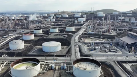 Large oil refinery complex with storage tanks, pipelines and processing units Stock Footage 334603227