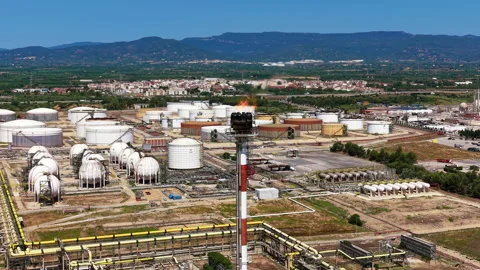 Large oil refinery complex with storage tanks, spherical vessels, flare stack Stock Footage 343888959