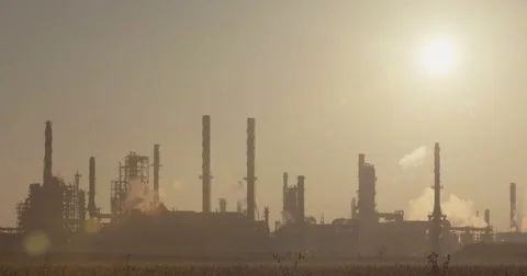 Large oil refinery with sun in the background Stock Footage 74266463