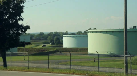 Large oil tanks at sunset, medium shot Stock Footage 41511959