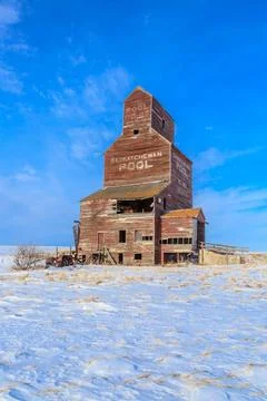 A large, old, abandoned grain elevator Stock Photos