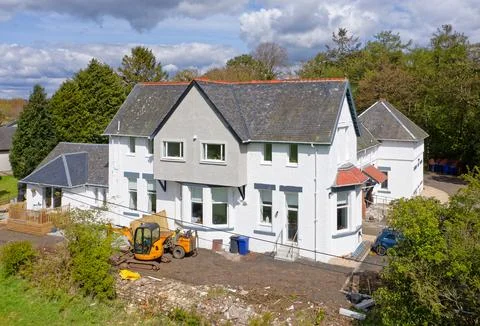Large old building being converted into apartments in rural setting Stock Photos
