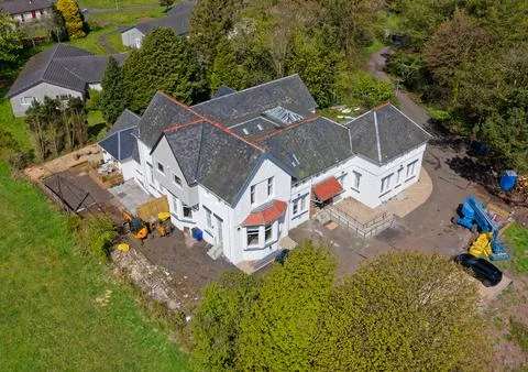 Large old building being converted into apartments in rural setting Stock Photos