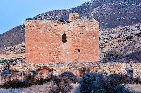 A large, old building with a window on the side Stock Photos