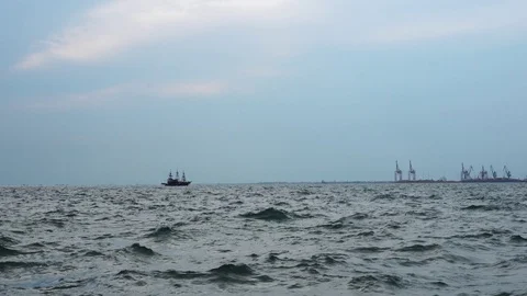 Large old fashioned retro sail ship sailing across dark blue cloudy ocean Stock Footage 94986239