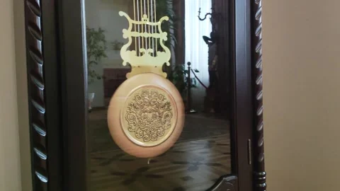 Large old pendulum of an antique clock, close-up, design Stock Footage 289528134