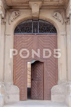 Large old wooden gate with door Stock Photos