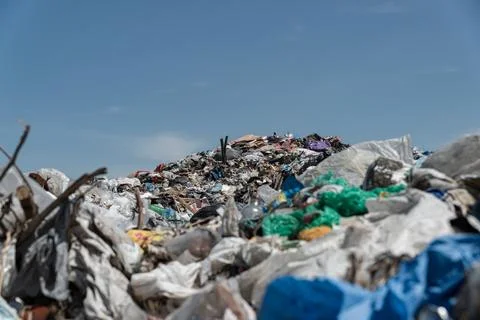 A large open-air garbage dump. Close-up of plastic waste at the landfill. Stockfoto's