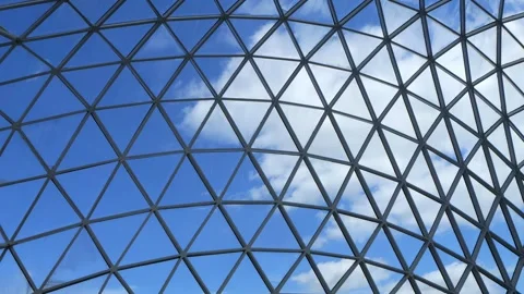 Large, open building with a blue sky and clouds Vídeos de archivo 311062811