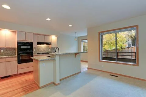 Large open kitchen with granite counter tops, maple cabinets with built in bl Stock Photos
